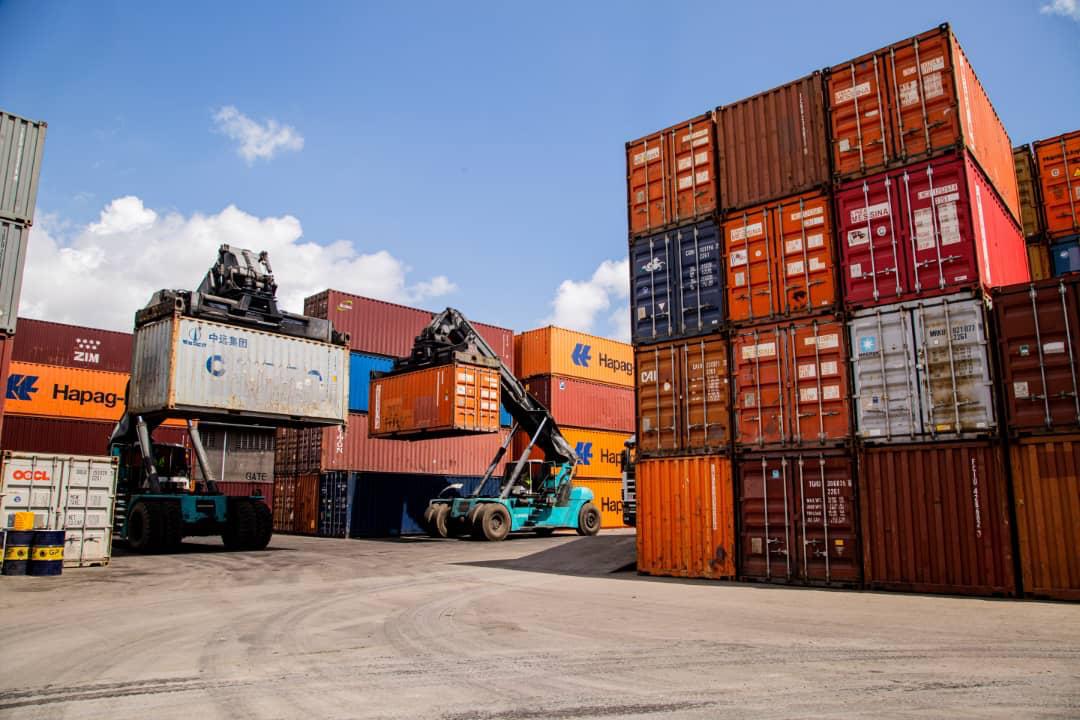 Two reach stackers lifting containers side by side at NURAB ICD