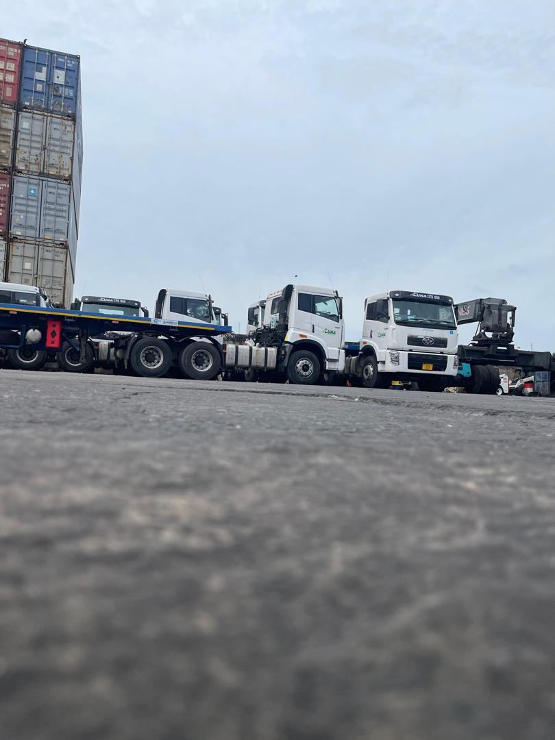 FAW truck-tractor fleet parked at the depot yard